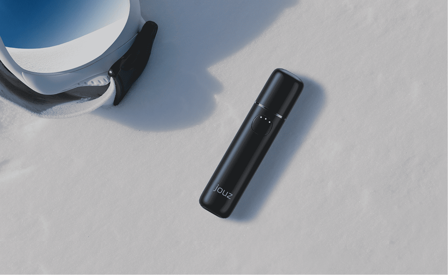 Jouz device placed on snow next to ski goggles, used as a visual in the case study on Russia-Promo.