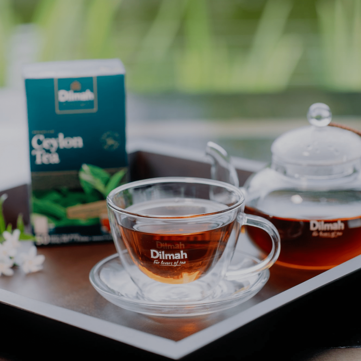 Tea set with Dilmah Ceylon Tea packaging, cup, and teapot on a tray, used as a visual in the case study on Russia-Promo