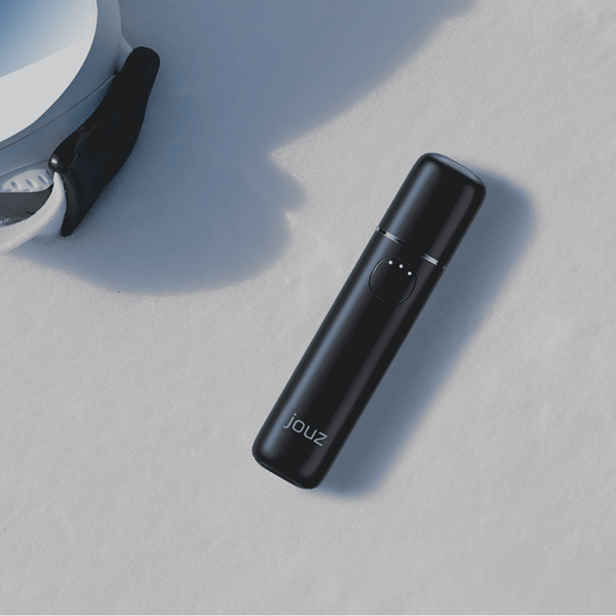 Jouz device placed on snow next to ski goggles, used as a visual in the case study on Russia-Promo.