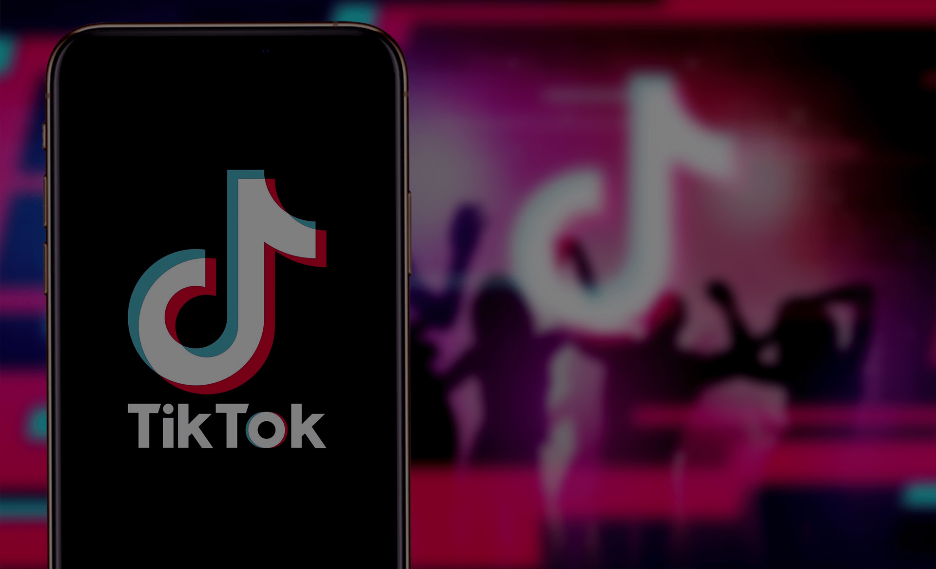 TikTok logo on a phone screen, with a blurred background, featured in the TikTok case study on the Russia-Promo website